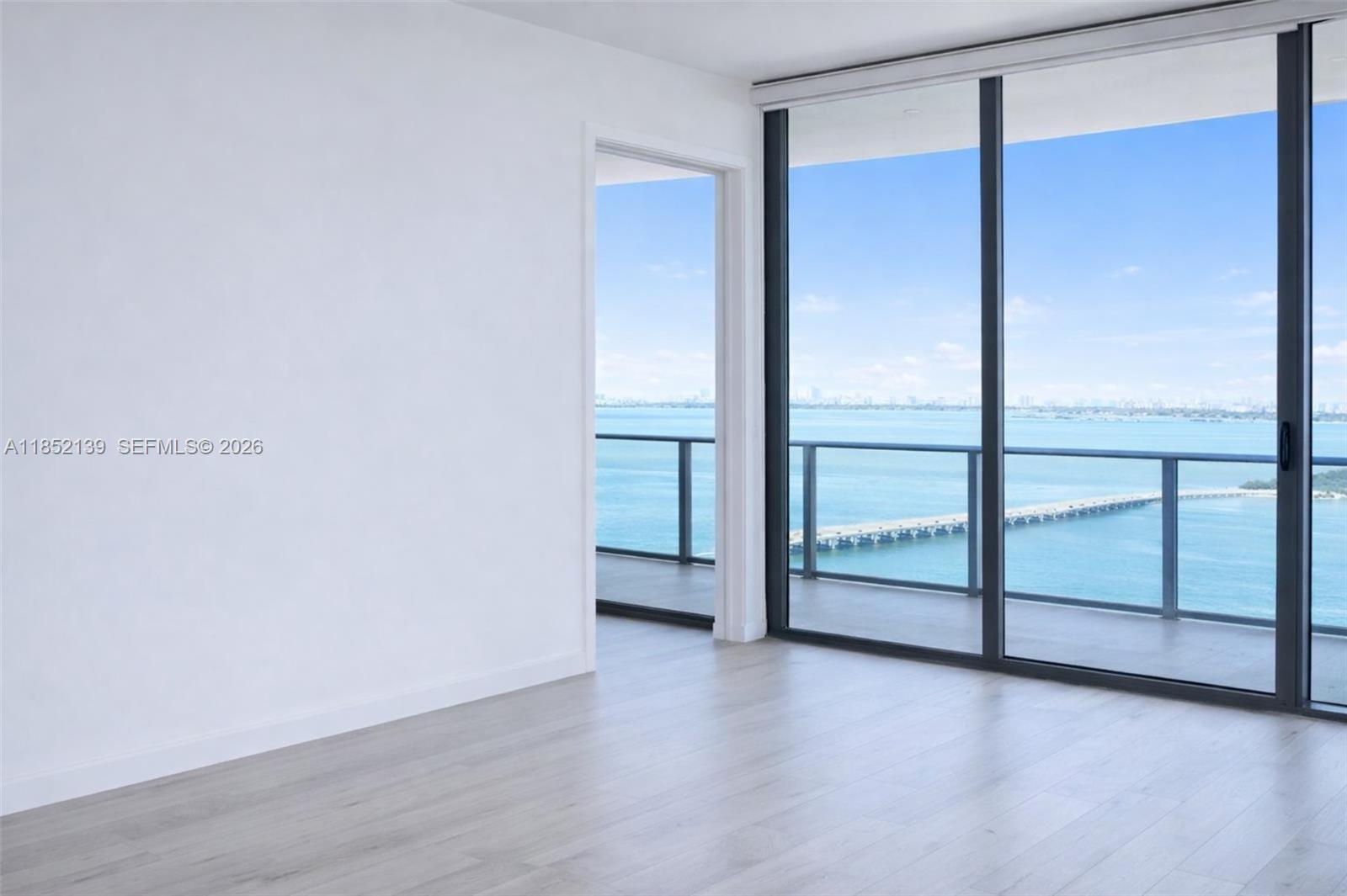 480 Northeast 31st Street, Unit 3301 Miami, FL 33137 - Photo 2 of 32 a view of an empty room with a window