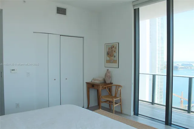 a bedroom with a bed and a table in it