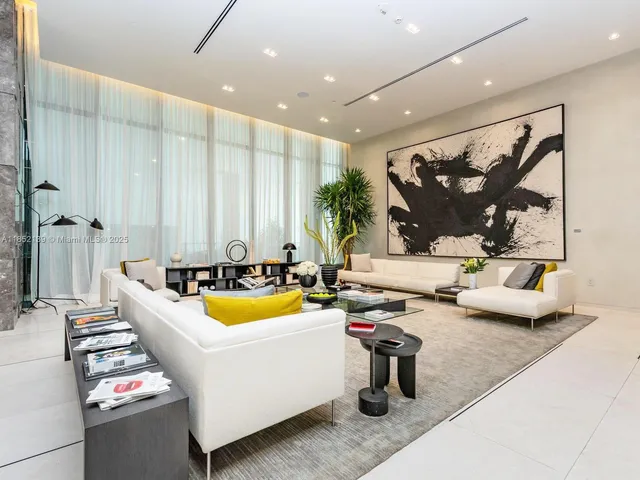 a bathroom with a tub a sink and mirror