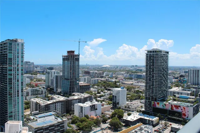 a view of a city with tall buildings