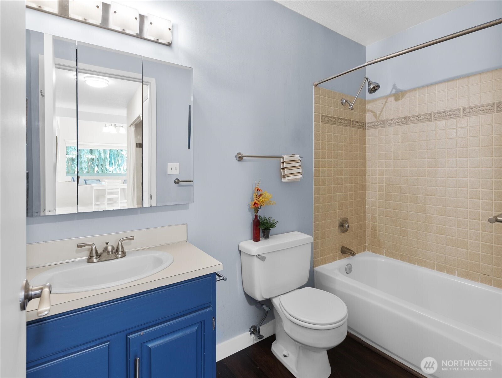 3024 Northeast 143rd Street, Unit 305 Seattle, WA 98155 - Photo 14 of 17 a bathroom with a sink toilet and shower