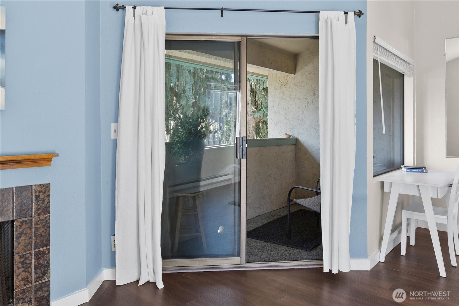 3024 Northeast 143rd Street, Unit 305 Seattle, WA 98155 - Photo 15 of 17 a view of entryway with wooden floor and glass door