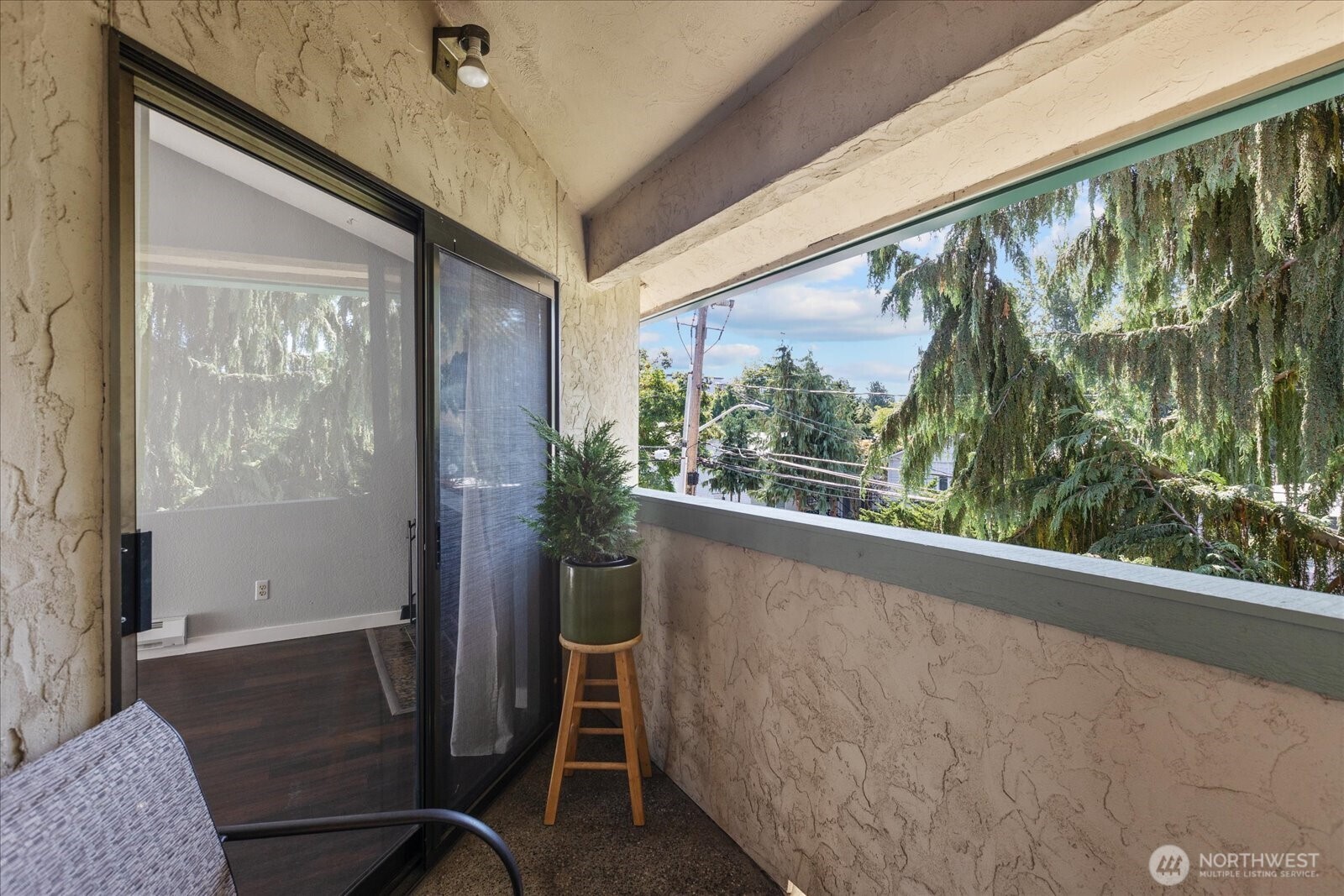 3024 Northeast 143rd Street, Unit 305 Seattle, WA 98155 - Photo 17 of 17 a view of a room that has a bench in it