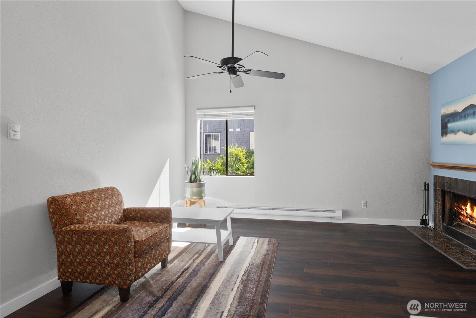 3024 Northeast 143rd Street, Unit 305 Seattle, WA 98155 - Photo 3 of 17 a living room with furniture and a wooden floor
