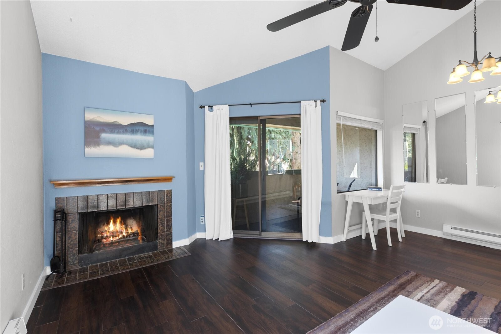 3024 Northeast 143rd Street, Unit 305 Seattle, WA 98155 - Photo 5 of 17 a living room with furniture and a fireplace