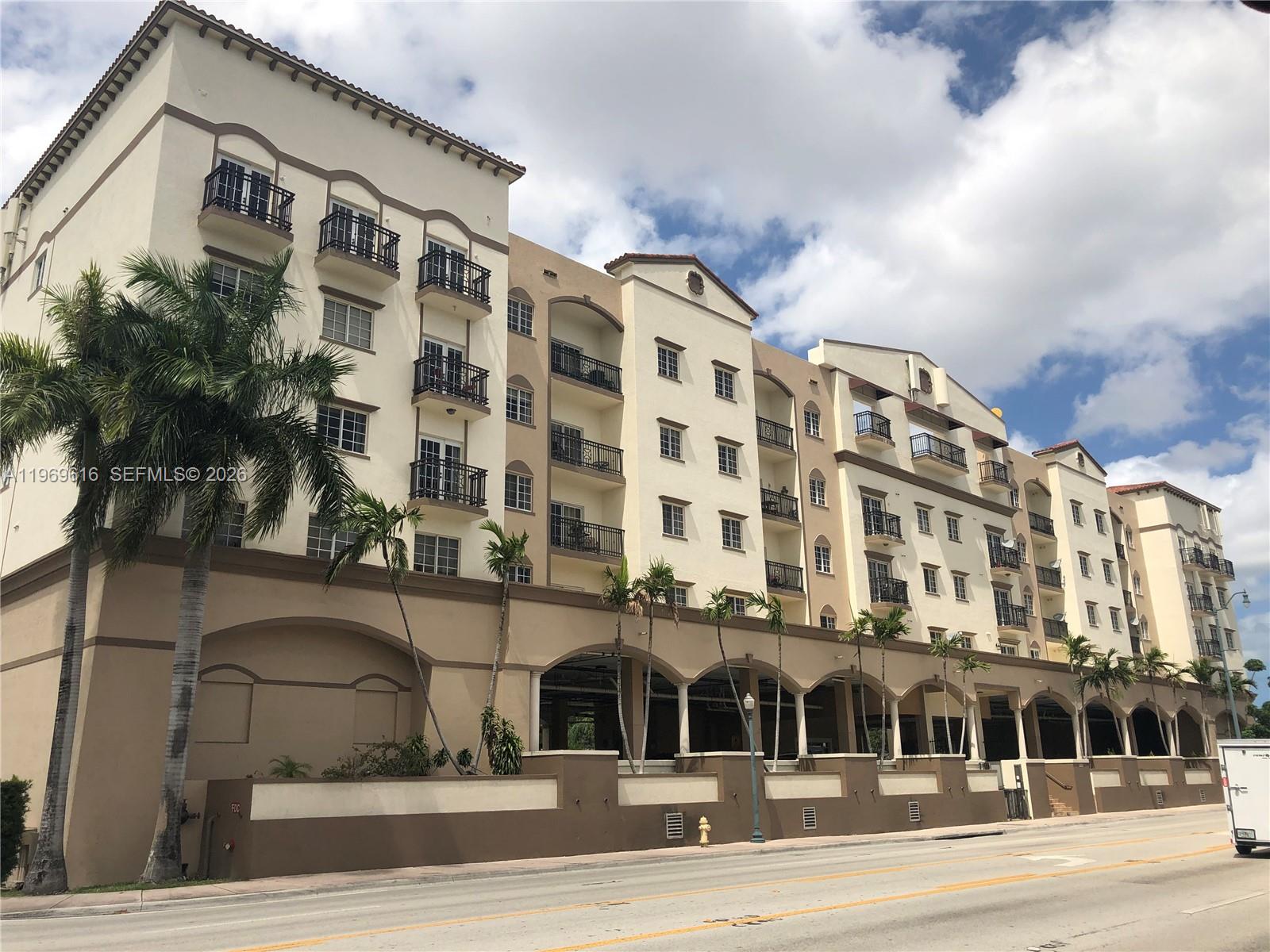 5271 Southwest 8th Street, Unit 503 Miami, FL 33134 - Photo 1 of 13 a view of a building and a street
