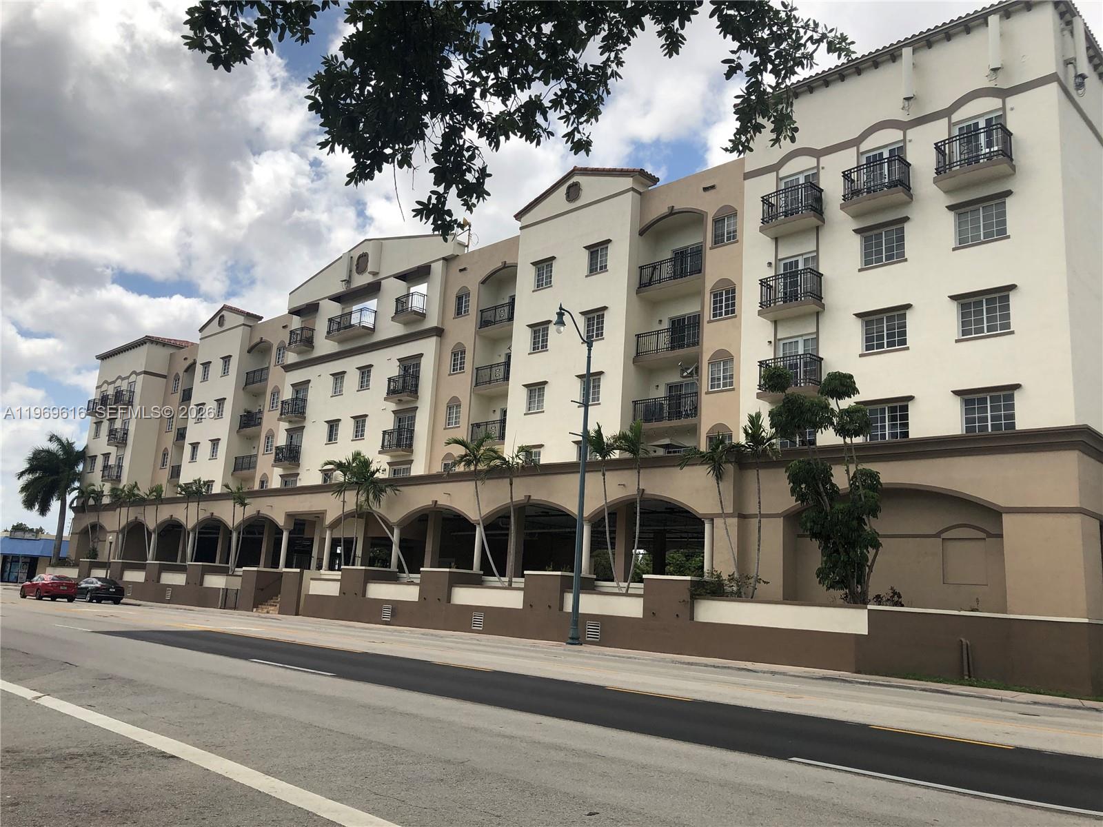 5271 Southwest 8th Street, Unit 503 Miami, FL 33134 - Photo 2 of 13 a view of a building with a street