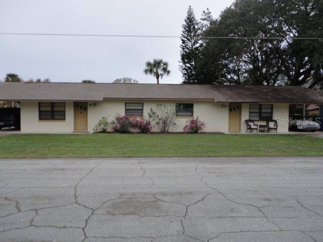 84 7th Street St. Cloud, FL 34769 - Photo 1 of 1 a front view of house with yard and green space
