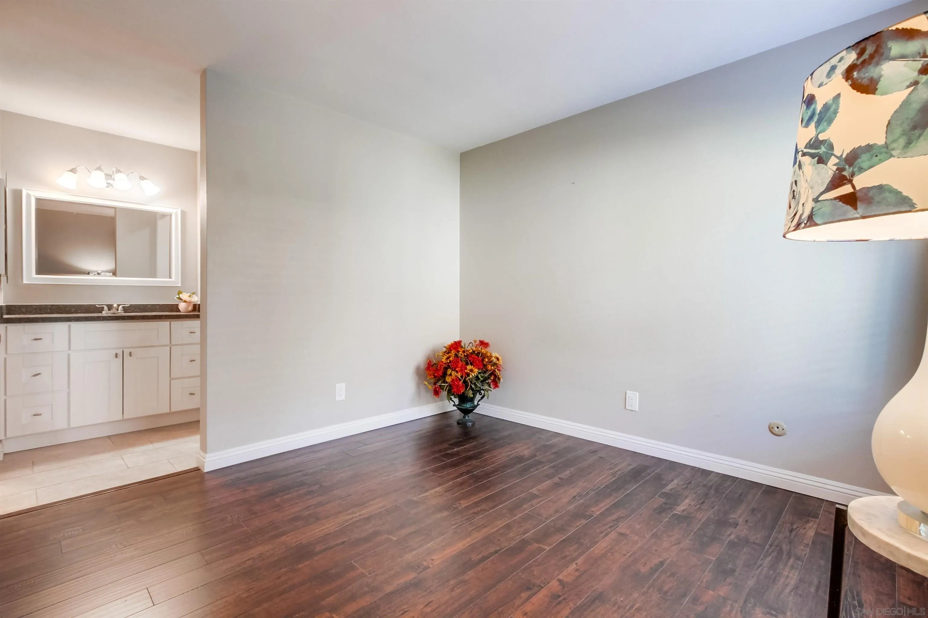 5970 Rancho Mission Road, Unit 241 San Diego, CA 92108 - Photo 16 of 26 an empty room with wooden floor and cabinet