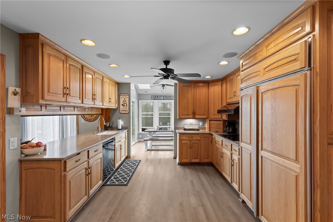 64508 Slade Road Cambridge, OH 43725 - Photo 10 of 50 Kitchen featuring recessed lighting, light wood-type flooring, dishwasher, ceiling fan, and paneled fridge
