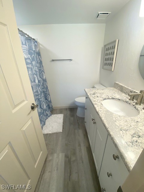 16007 Davis Road, Unit 614 Fort Myers, FL 33908 - Photo 12 of 17 a spacious bathroom with a granite countertop sink and a mirror