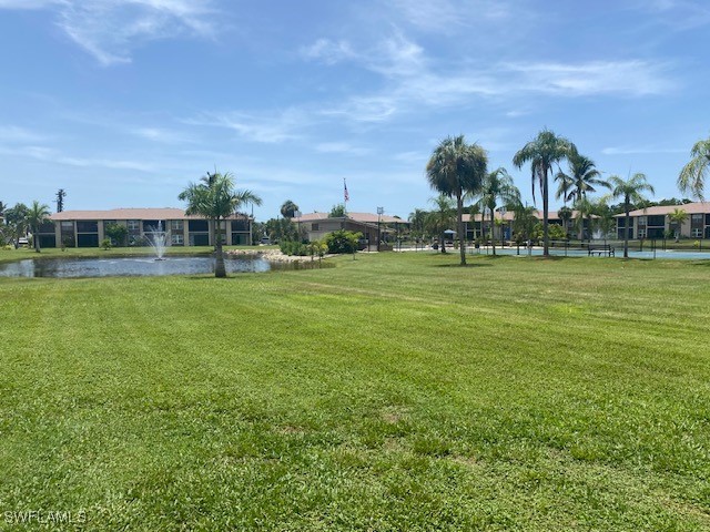 16007 Davis Road, Unit 614 Fort Myers, FL 33908 - Photo 17 of 17 a view of a golf course with a lake