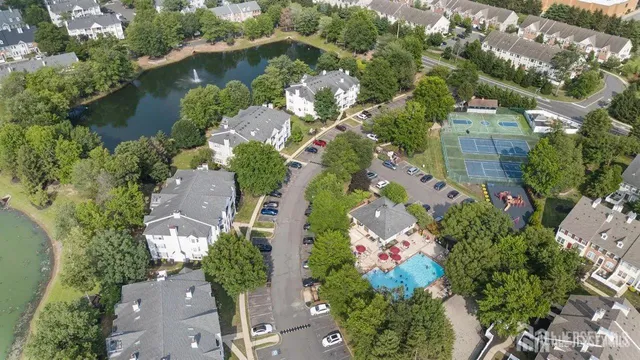 an aerial view of a house with yard