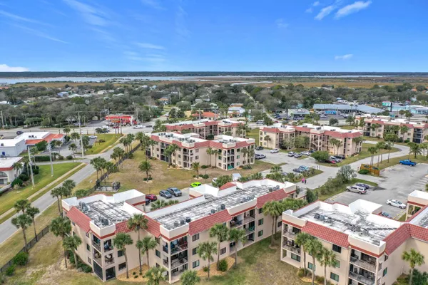 an aerial view of residential houses with outdoor space