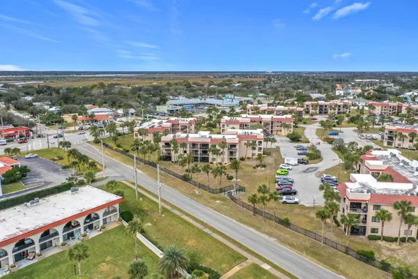 an aerial view of a city with lawn chairs