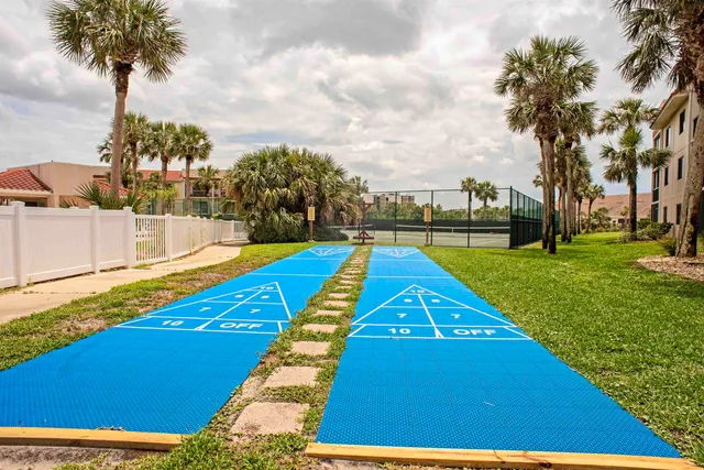 a view of swimming pool is middle in front of residential houses