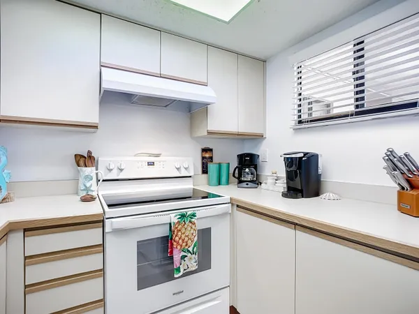 a kitchen with appliances cabinets and a sink