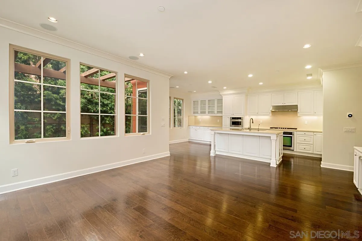 82 Brindisi Irvine, CA 92618 - Photo 11 of 49 a view of large kitchen with cabinets and wooden floor