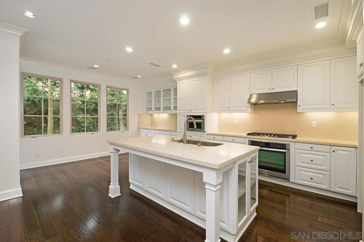 82 Brindisi Irvine, CA 92618 - Photo 13 of 49 a kitchen with a stove and a sink