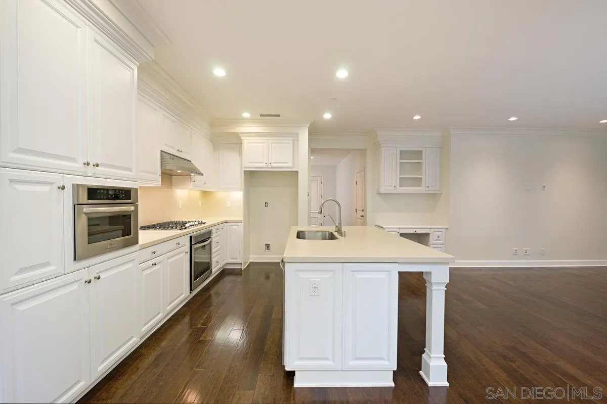 82 Brindisi Irvine, CA 92618 - Photo 16 of 49 a kitchen with a sink stainless steel appliances and cabinets