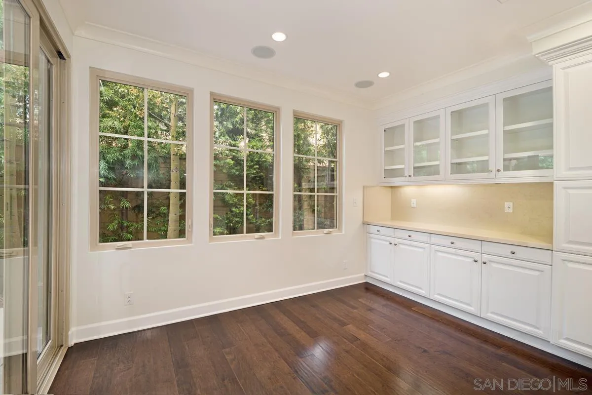 82 Brindisi Irvine, CA 92618 - Photo 18 of 49 a view of an empty room with wooden floor and a window