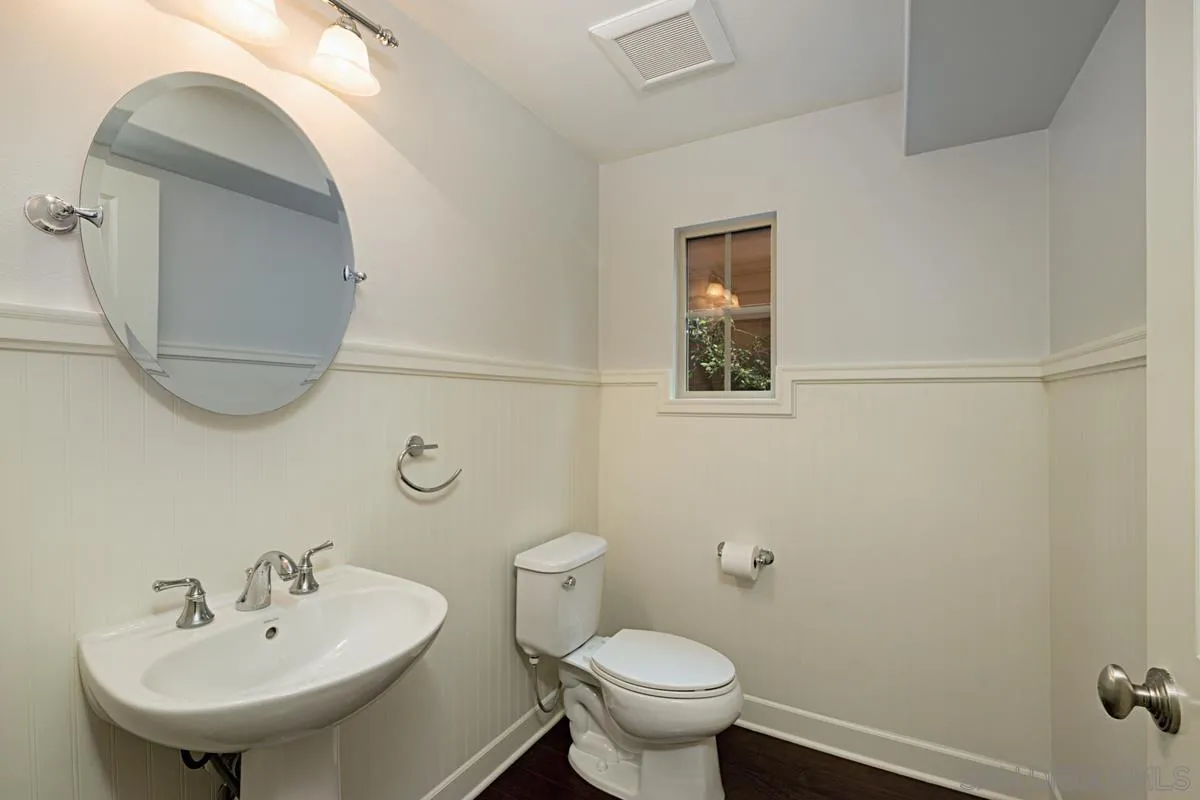 82 Brindisi Irvine, CA 92618 - Photo 20 of 49 a bathroom with a sink a toilet and mirror