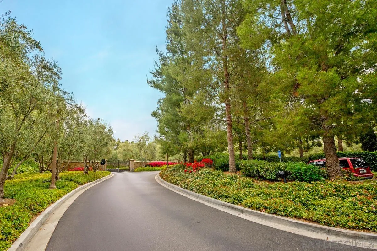 82 Brindisi Irvine, CA 92618 - Photo 36 of 49 a view of a street with a tree in the background