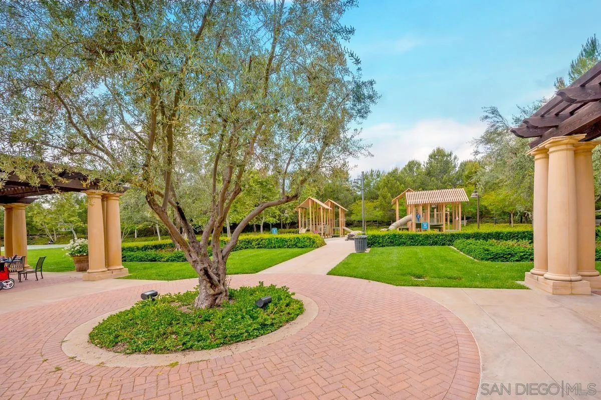 82 Brindisi Irvine, CA 92618 - Photo 38 of 49 a front view of a house with a yard and trees