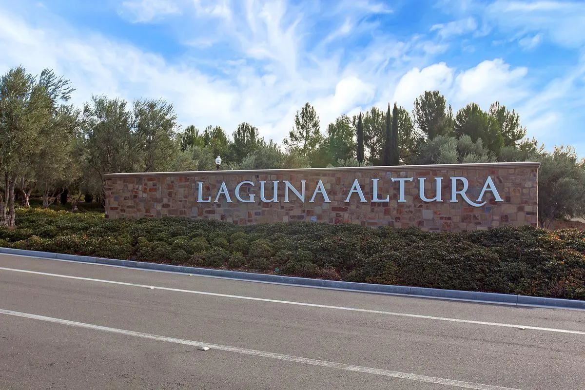 82 Brindisi Irvine, CA 92618 - Photo 41 of 49 a view of outdoor space with signage and flags