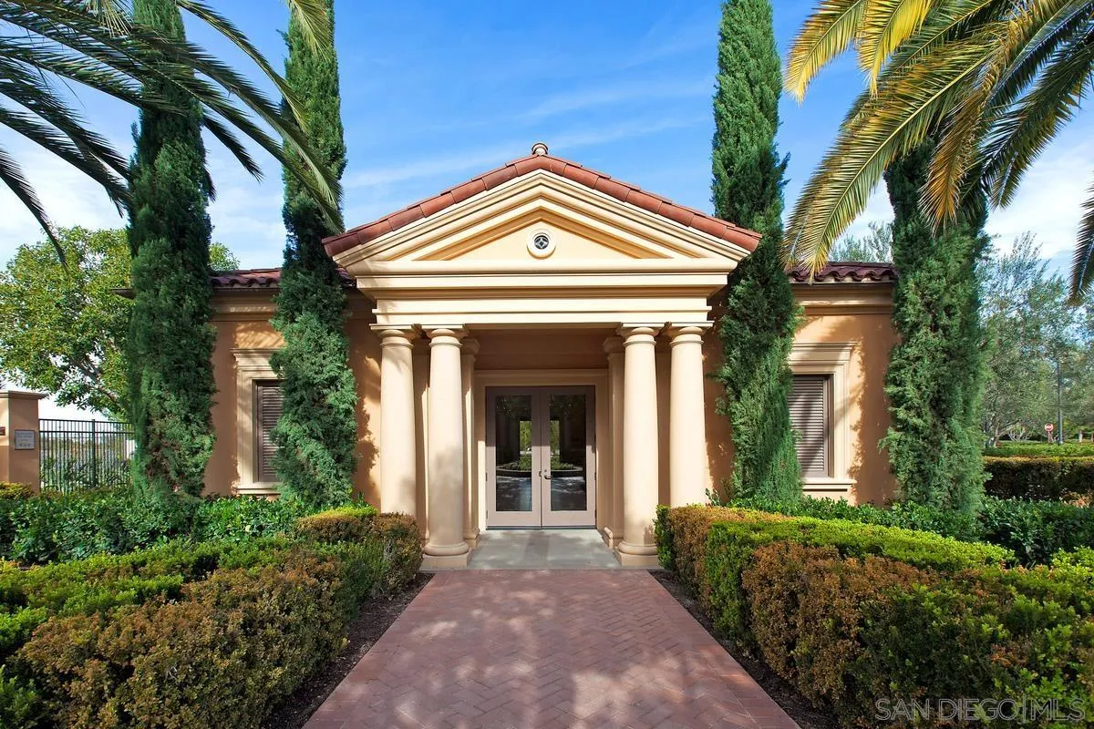 82 Brindisi Irvine, CA 92618 - Photo 42 of 49 a view of a house with a large window and potted plants