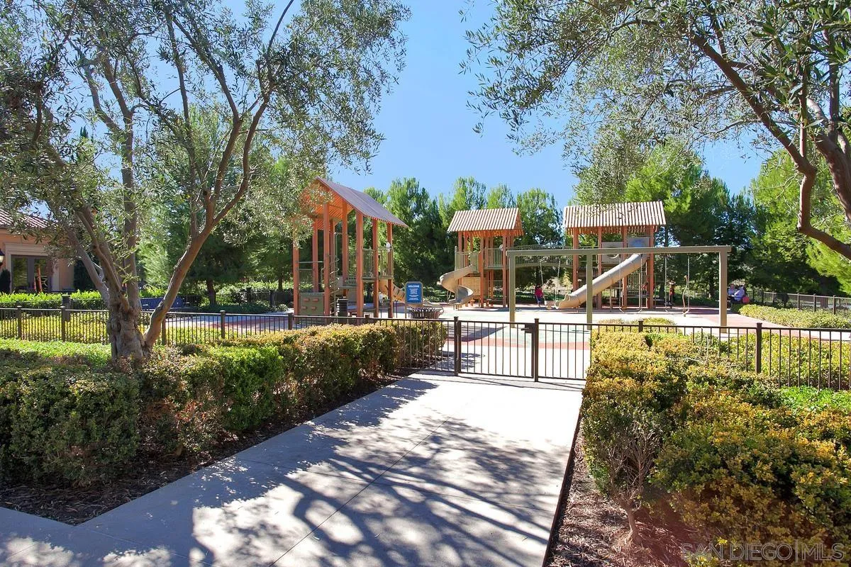 82 Brindisi Irvine, CA 92618 - Photo 47 of 49 a view of a park with swings and a table