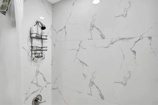 a view of a porch with furniture and garden