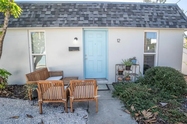 a kitchen with a sink a refrigerator and a stove top oven