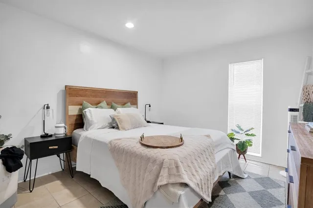 a bedroom with a bed and a table