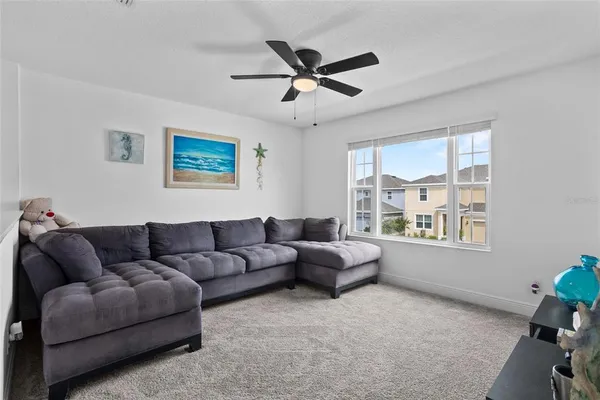 a living room with furniture and a window