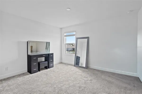a big room with closet and natural light