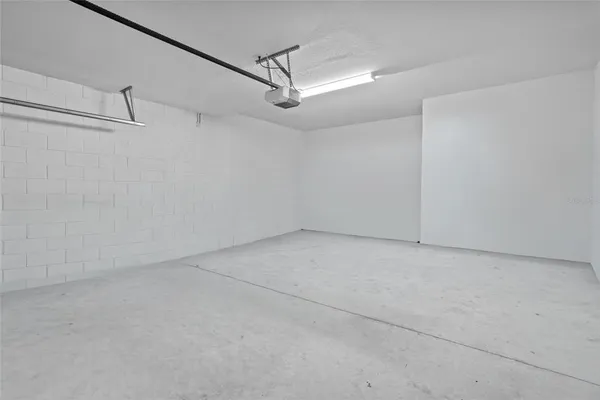 a view of a room with an empty ceiling fan