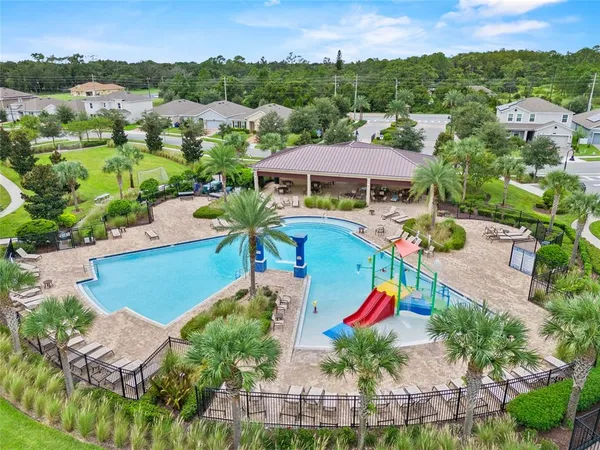 an aerial view of a house with a swimming pool