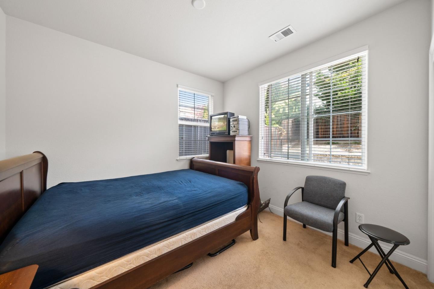 318 Rothbury Way San Ramon, CA 94582 - Photo 30 of 53 a bedroom with a bed and a chair