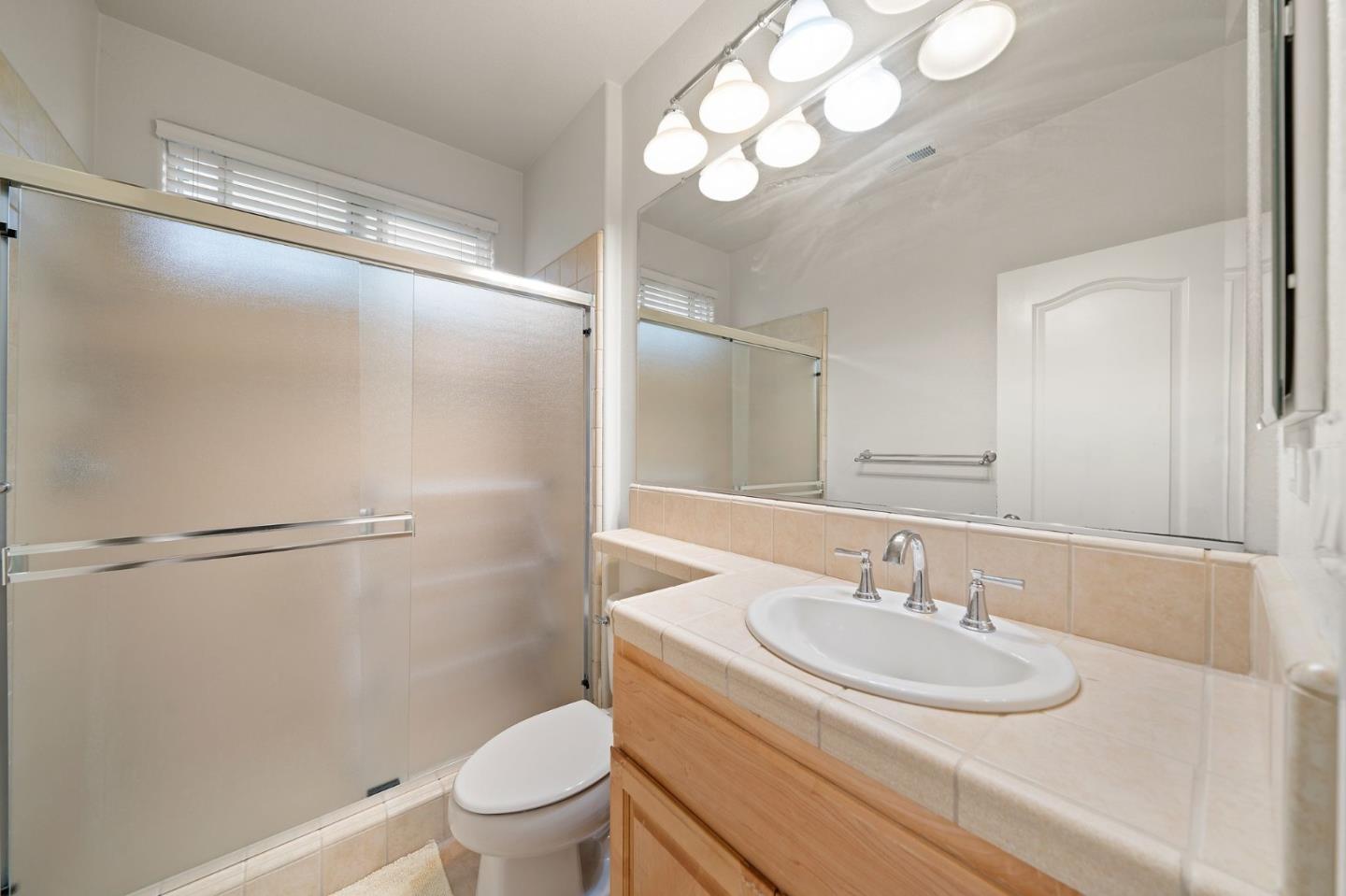 318 Rothbury Way San Ramon, CA 94582 - Photo 38 of 53 a bathroom with a sink toilet and a mirror