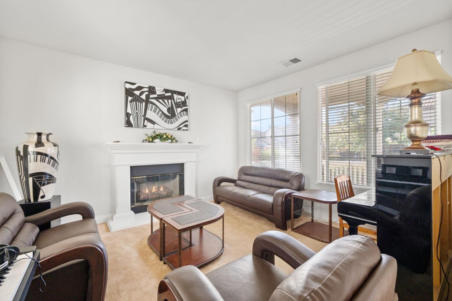 318 Rothbury Way San Ramon, CA 94582 - Photo 6 of 53 a living room with furniture a fireplace and a flat screen tv
