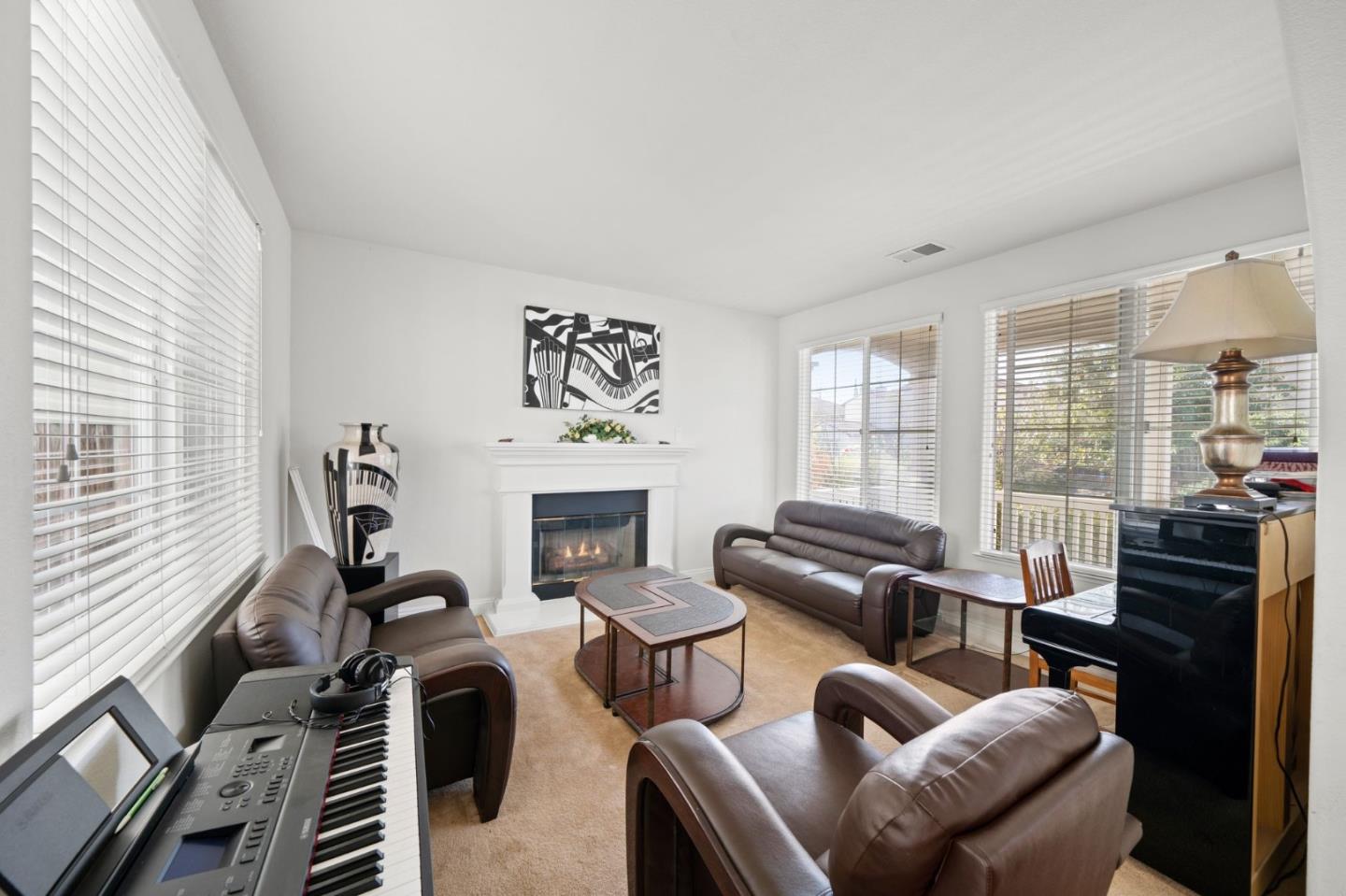 318 Rothbury Way San Ramon, CA 94582 - Photo 10 of 53 a living room with furniture a fireplace and a large window