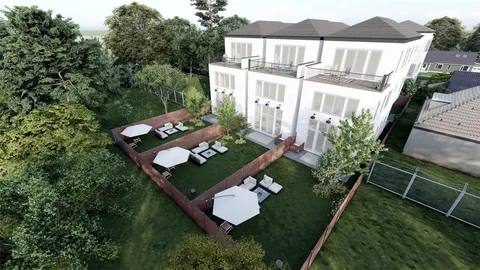 an aerial view of a house with backyard