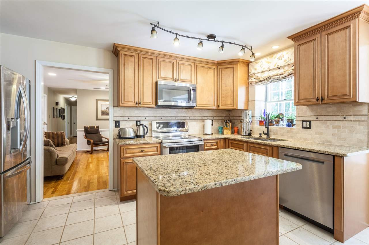 8709 Kenilworth Drive Raleigh, NC 27613 - Photo 12 of 30 Kitchen and center island