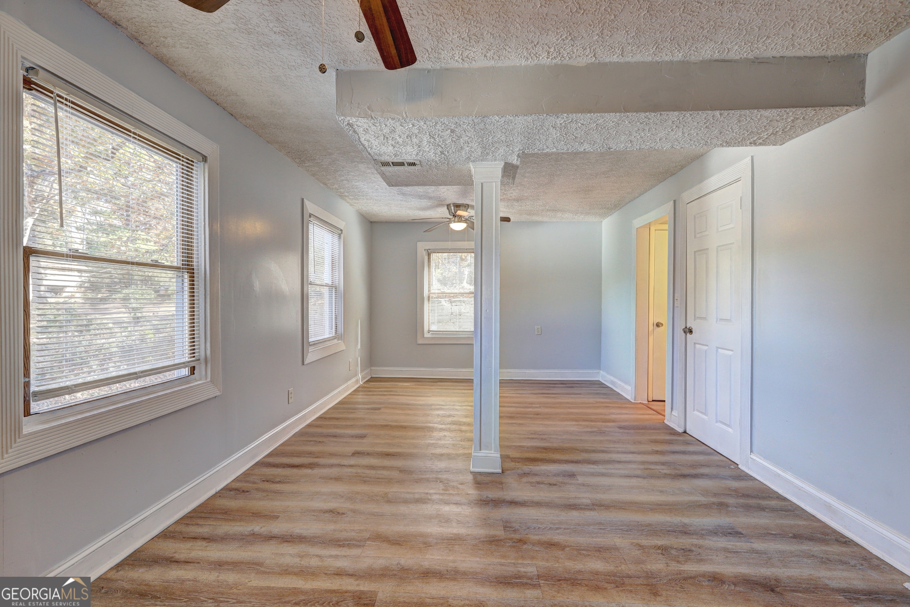 2270 Cresta Drive Decatur, GA 30032 - Photo 12 of 26 a view of an empty room with window and wooden floor