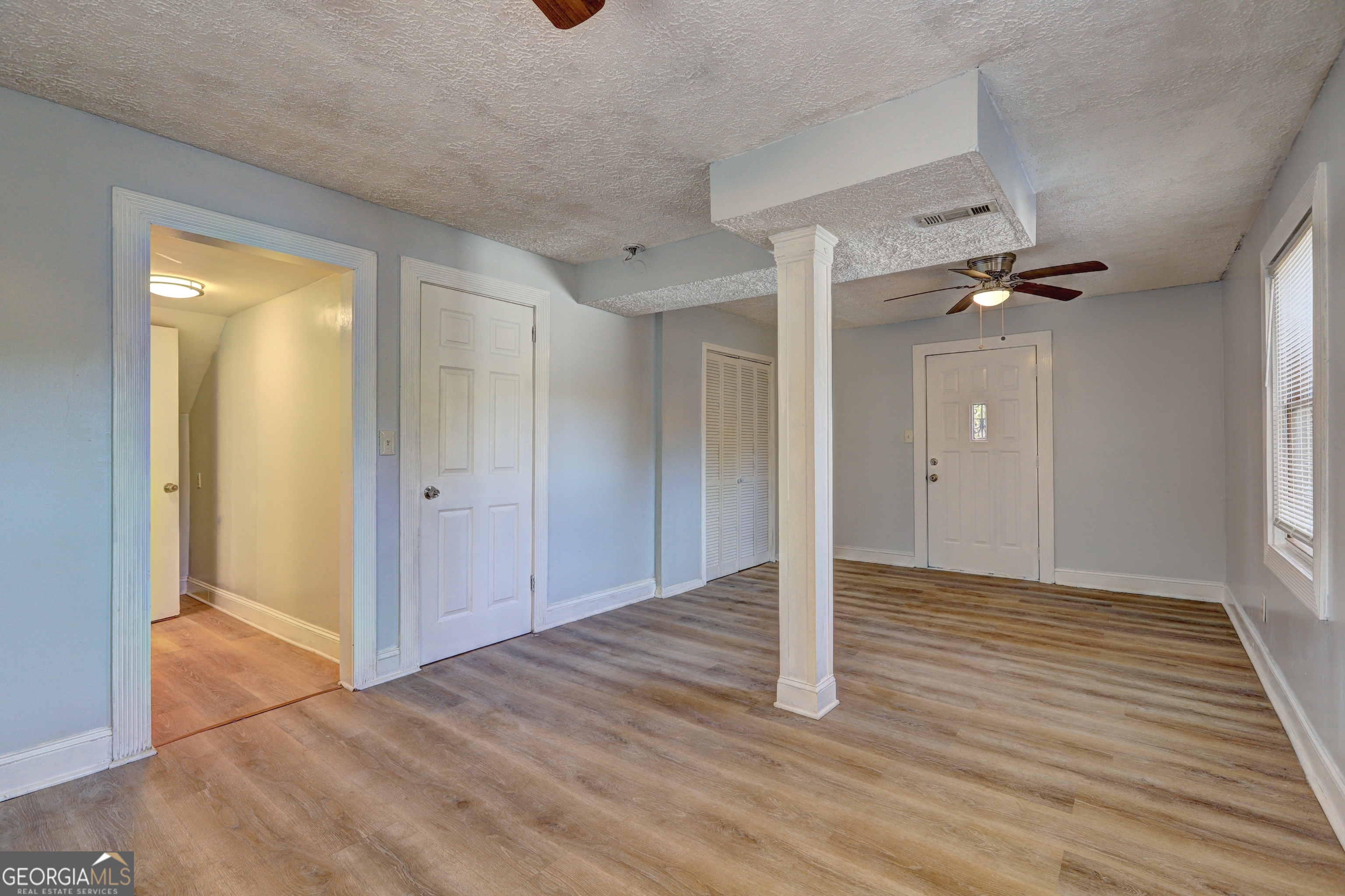 2270 Cresta Drive Decatur, GA 30032 - Photo 13 of 26 a view of a livingroom with wooden floor and a bathroom