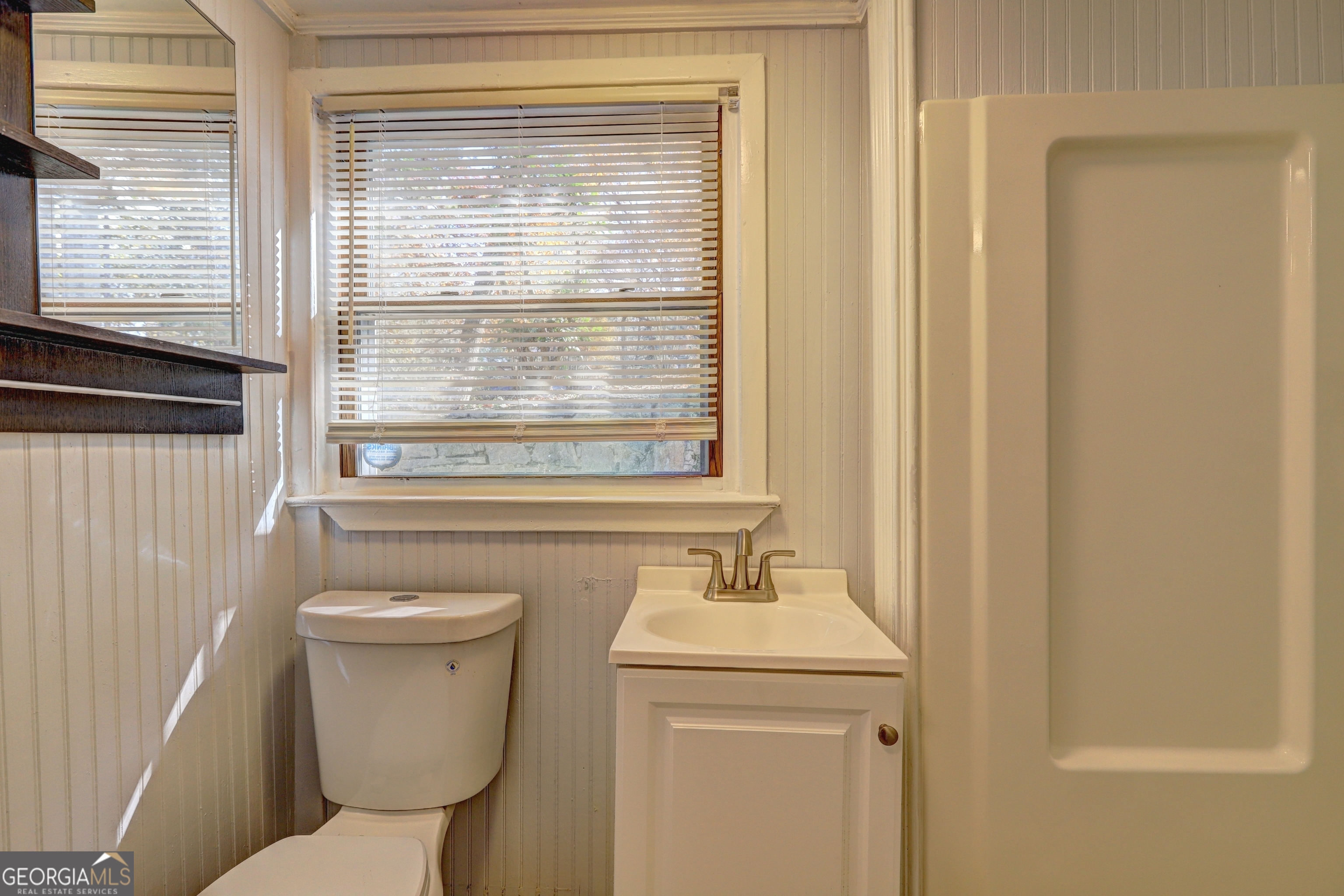 2270 Cresta Drive Decatur, GA 30032 - Photo 14 of 26 a bathroom with a sink a toilet and a window