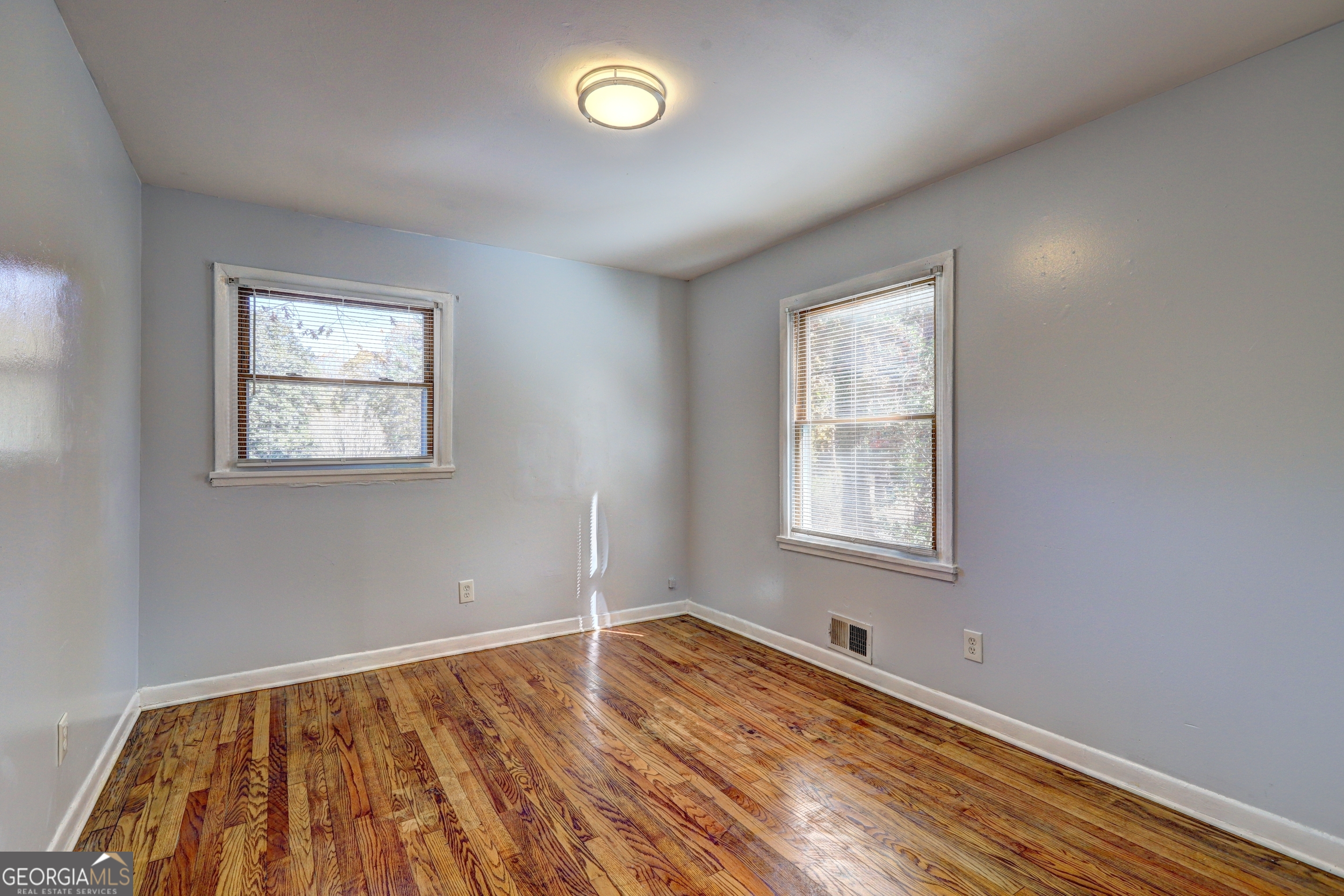 2270 Cresta Drive Decatur, GA 30032 - Photo 16 of 26 a view of an empty room with wooden floor and a window
