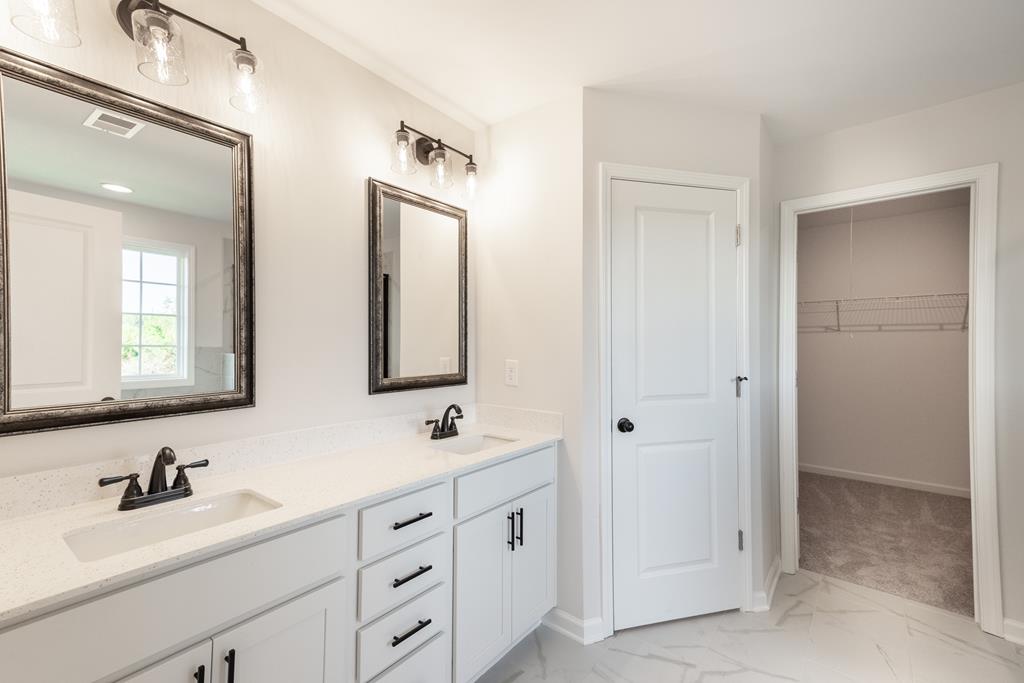 42 Hawkeye Trail Fortson, GA 31808 - Photo 14 of 29 a bathroom with double vanity sinks and a mirror