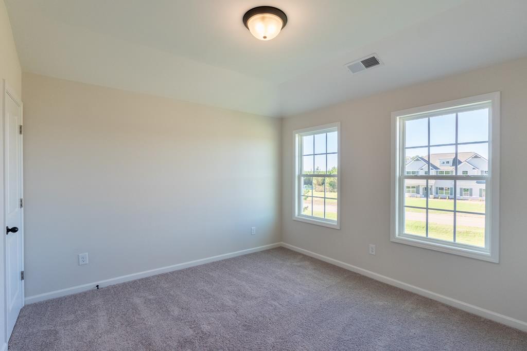 42 Hawkeye Trail Fortson, GA 31808 - Photo 20 of 29 an empty room with windows and closet